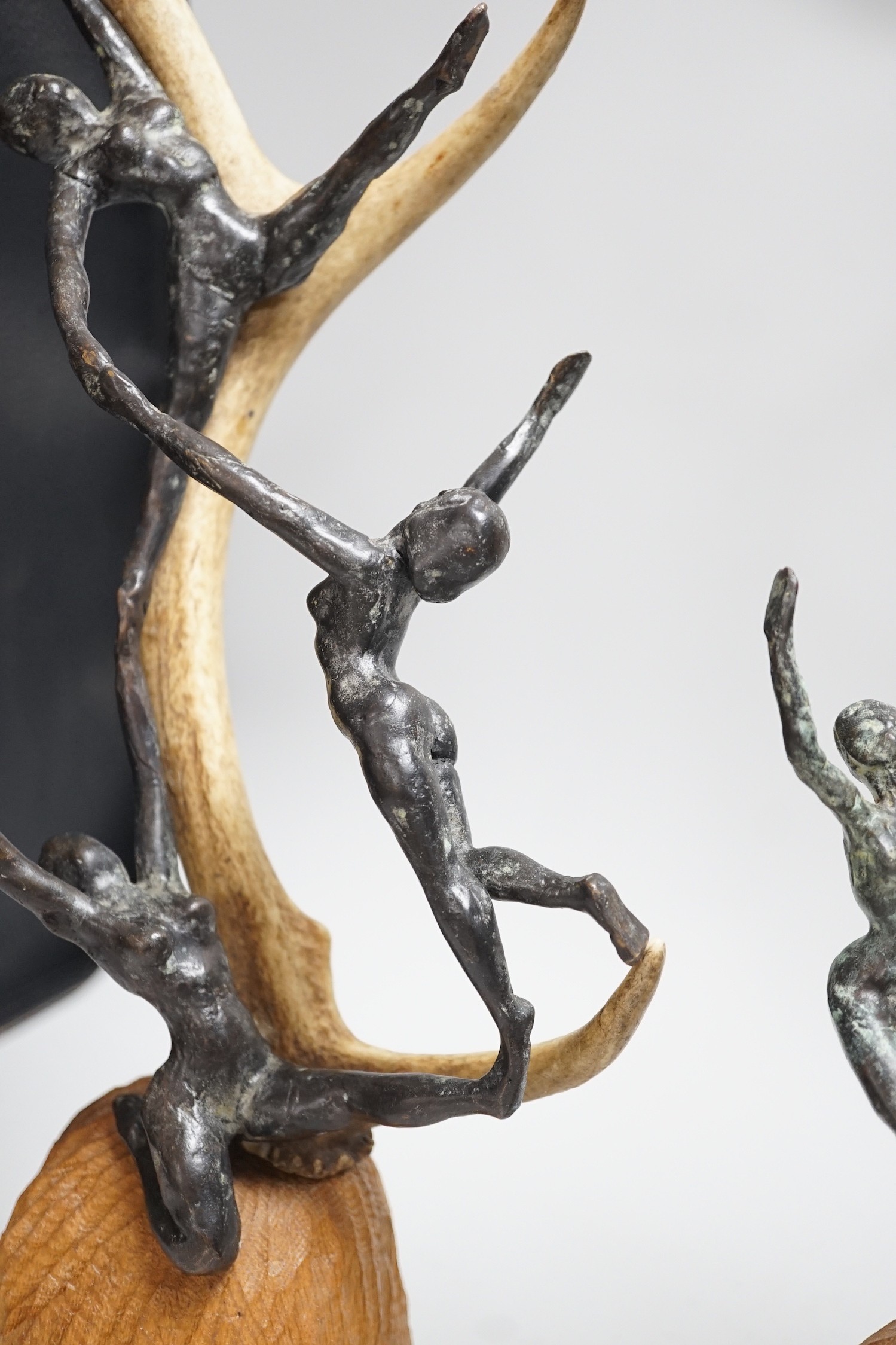 A pair of bronze and antler dancer groups in the style of Edgar Degas, 49cms high